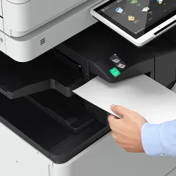Person using a copy machine at DARE Print & Sign Co
